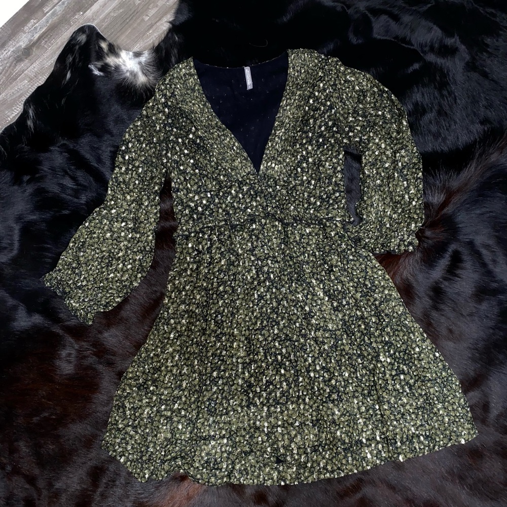 Dark olive green buttoned up v-neck with a hint of gold shimmer fun. Mini dress